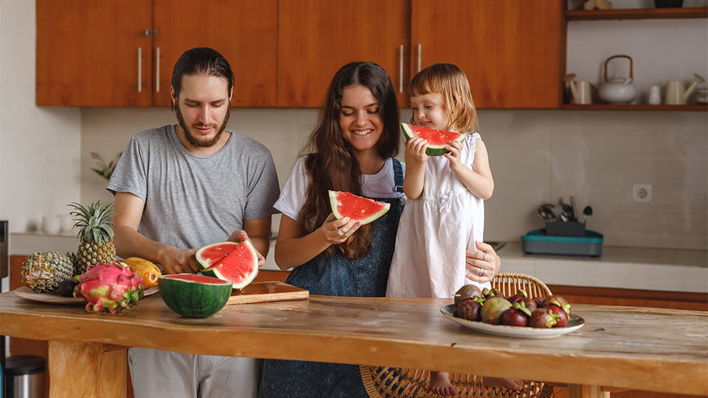 Family enjoying watermelon