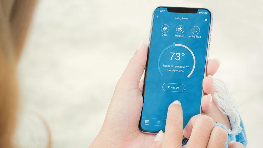 A woman is using cielo home app
