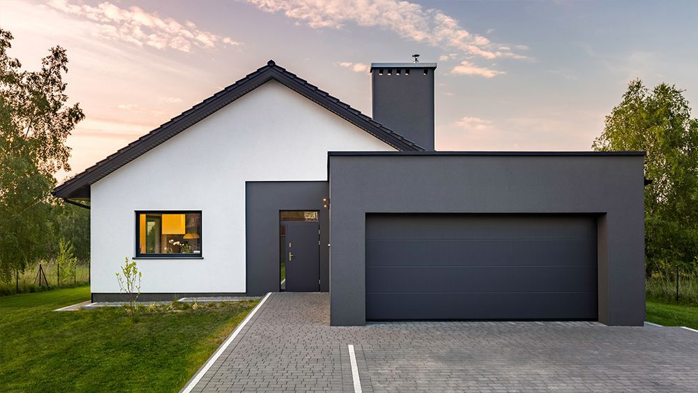 Modern house with a gray themed garage attached to the front