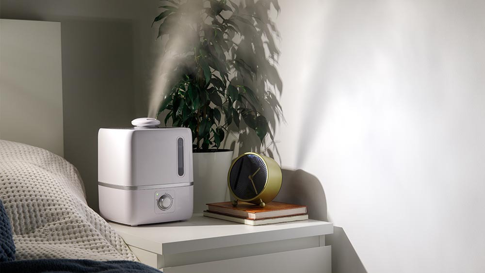 Humidifier on a bedside table in a bedroom